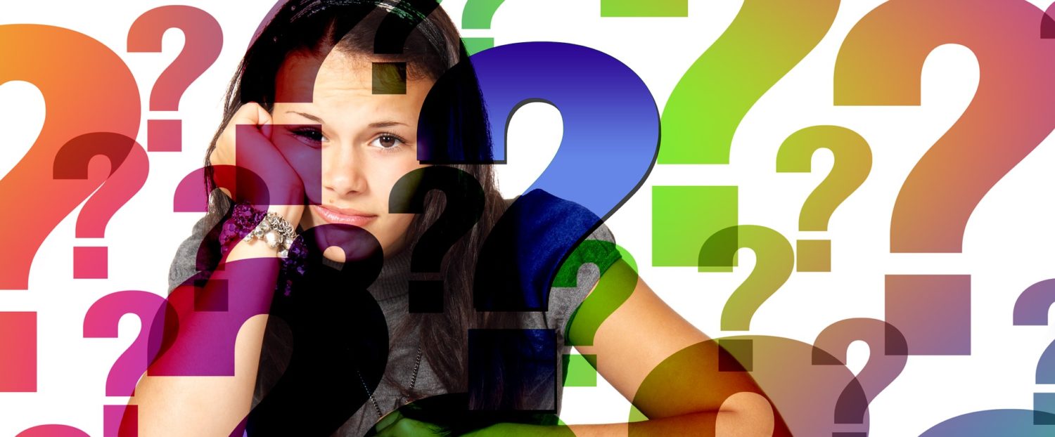 Young Woman surrounded by question marks
